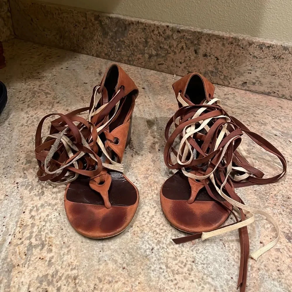 Balenciga woman’s brown wrap around ribbon wedge sandals
